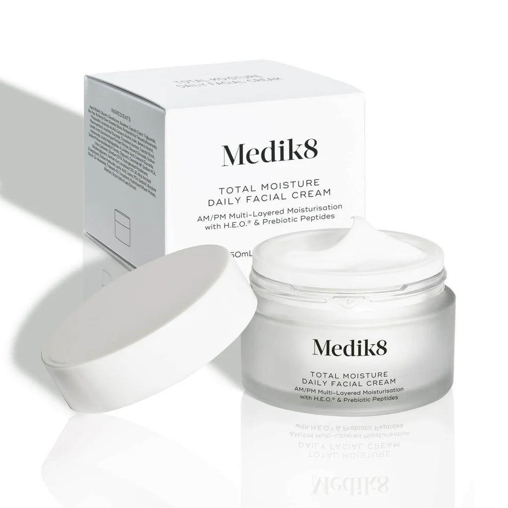 Medik8 Total Moisture Daily Face Cream jar shown open with its lid and outer carton on a white background.