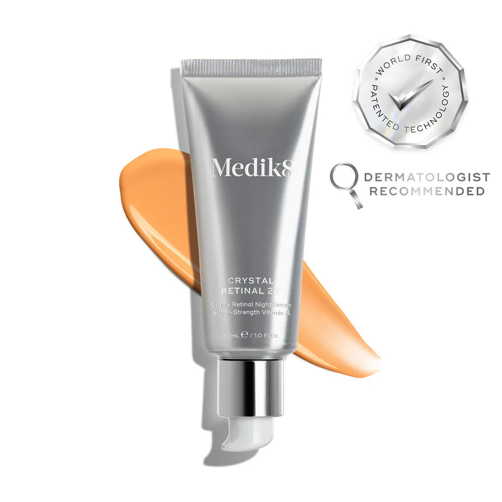 Medik8 Crystal Retinal 20 tube on a white background with an orange serum swatch, carrying World First Patented Technology and Dermatologist Recommended badges.